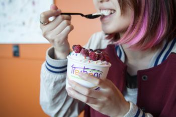 Girl eating frozen yogurt